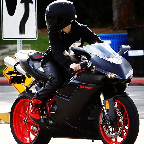 Black and Red  a chick riding it! guys i just realized this was justin  wowwww