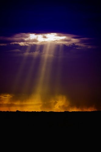 Crepuscular rays, I have always imagined God looking down and that's his light shinning through the clouds.