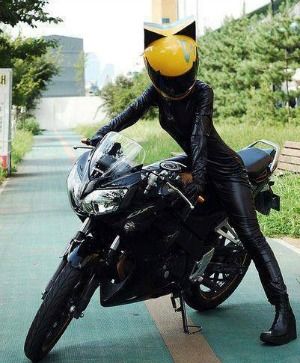 Female biker with cat ear motorcycle helmet