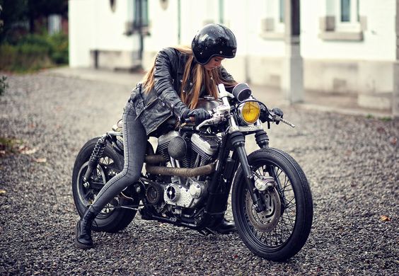 Lace boots, skinny pants, leather jacket, custom Harley cafe racer--it's a great look.