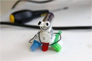 Make your own mini robot (AA battery, small motor, two pieces of wire, and some decorative parts)