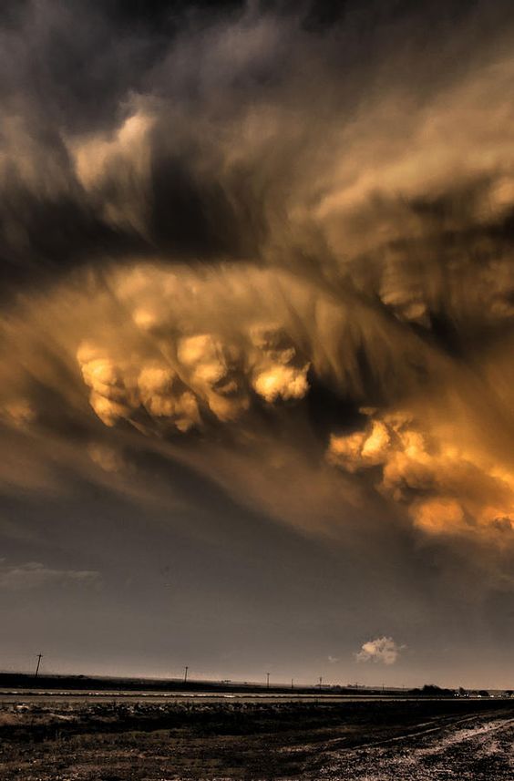 Mammatus clouds break out of the back side of a severe thunderstorm in the Texas panhandle. (Nov 2012)