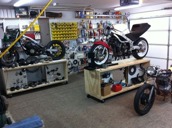 Rolling motorcycle work bench. Could be made to roll under workbench on the wall for storage and out of the way when not in use.