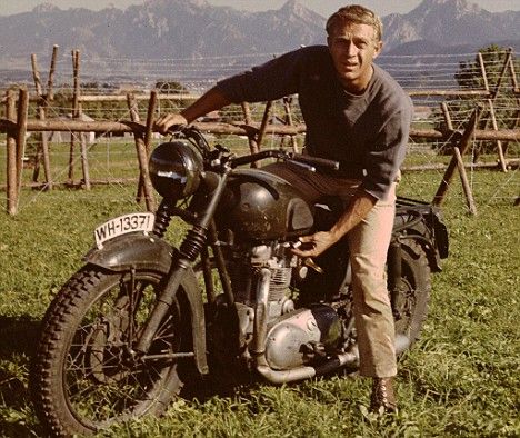 Steve McQueen in The Great Escape. They dressed up a Triumph to look like a German bike. One of the coolest motorcycle chase scenes put to film.