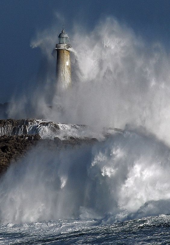 The power of the ocean storm battering the lighthouse.