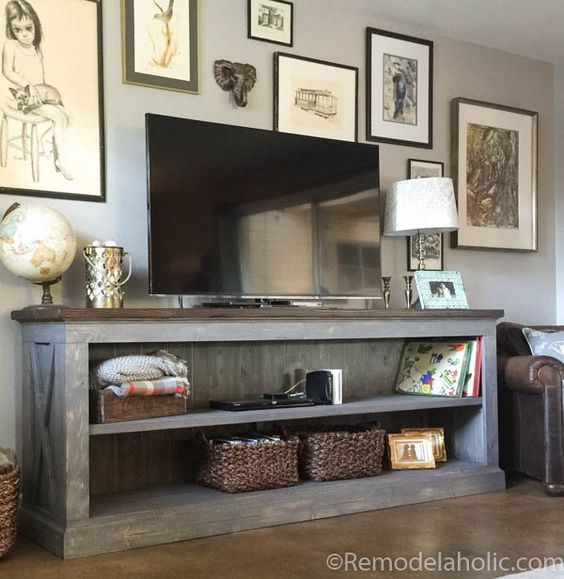 This farmhouse style TV console is perfect for storing your electronics, or us it in the dining room as a sideboard to hold serving dishes and decor. Designed by The Gritty Porch with building plans by Remodelaholic.
