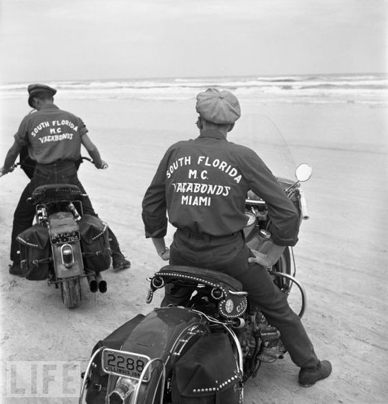 Two members of the Vagabonds Motorcycle Club (South Florida) maneuver their non-racing, single-seat hogs on the Daytona sands. For decades, the bikes that routinely won the Daytona 200 bore brand names like Indian, Norton, and Harley-Davidson. (1948)