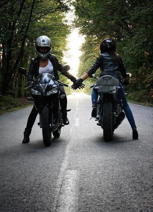 Two women crossing paths on a motorcycle ride