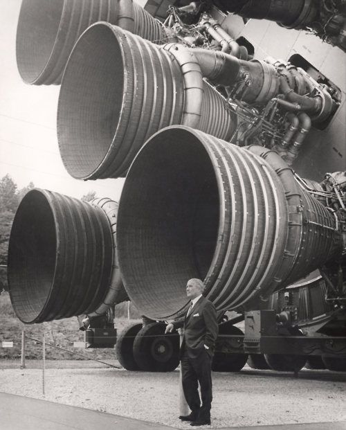 Werner von Braun standing in front of the Saturn V rocket in Rocket Park,  Space & Rocket Center, Huntsville, AL