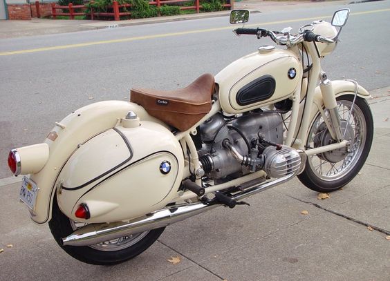 White vintage BMW with hard bags and  solo saddle. Absolutely gorgeous.