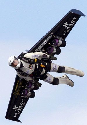 Yves Rossy flies through the air with a carbon-Kevlar jetwing (Price tag: 110,000), which is boosted by four engines that each supply a 45-pound thrust.