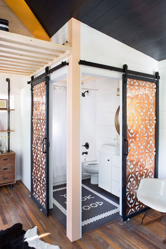 400  Small Boho-style House in Austin - it's two tiny houses on wheels put together. Check-out this bathroom - the double barn doors!