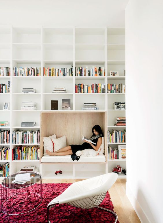 A cozy reading nook in a spacious home library.