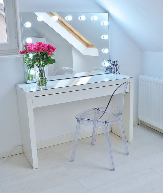 Absolutely love my new Ikea makeup vanity - absolutely no idea how I managed to live without it! This post contains way too many photos of how I use it to store my makeup, and how the dressing table looks in my newly decorated all-white bedroom. Oh and it's an - Ikea Malm dressing table, with an acrylic ghost chair and makeup vanity with lights!