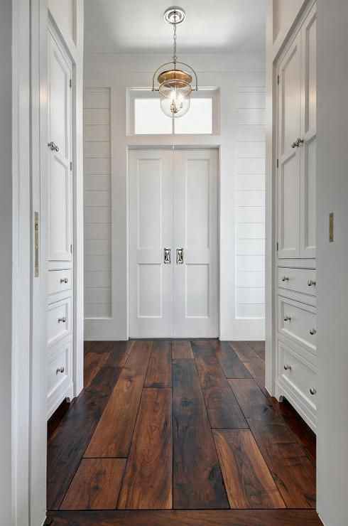 All white walls and dark wood floors. Simple and classic!