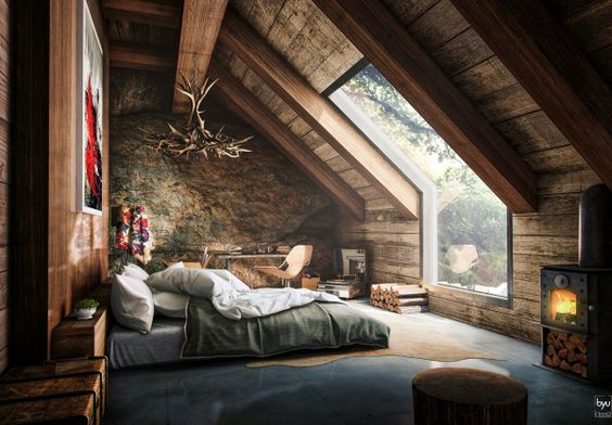 An attic bedroom that opens up into the forest is like a grown up treehouse in this design.