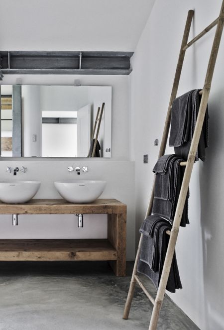 Beautiful timber creates a rustic look for this bathroom! Love timber ladders for hanging towels and magazines on!
