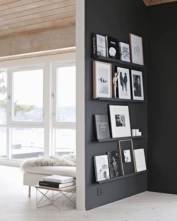 black painted wall with gallery shelves for picture frames // home renovation inspiration