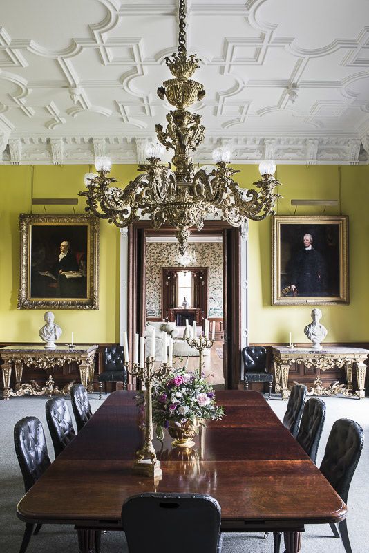Classic English country dining room with lemon walls