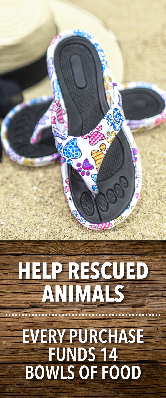 Click to shop now! Form-fitted, textured grip foot bed and soles make our Rainbow of Paws Flip Flops extra comfy and sets them apart while the splashy paw prints give them eye-candy appeal. Fashionable for the beach or wherever life takes you!
