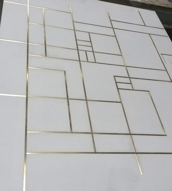 Concrete floor tiles with brass inlay
