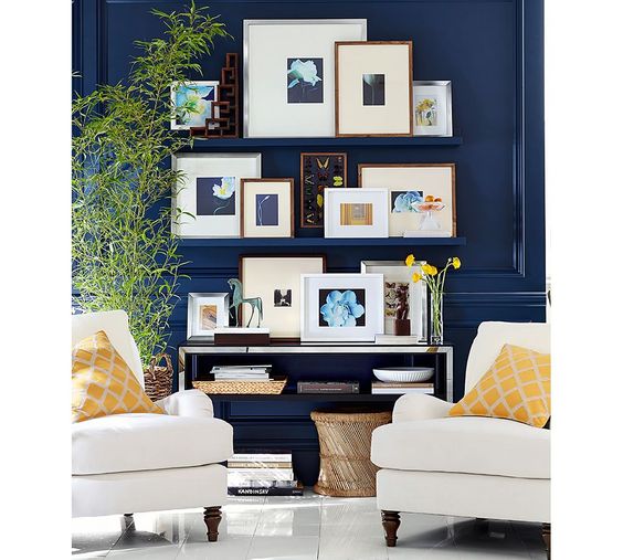 Create a gallery wall using wall mounted shelving. It gives you the versatility to change the look and art as the mood strikes you.