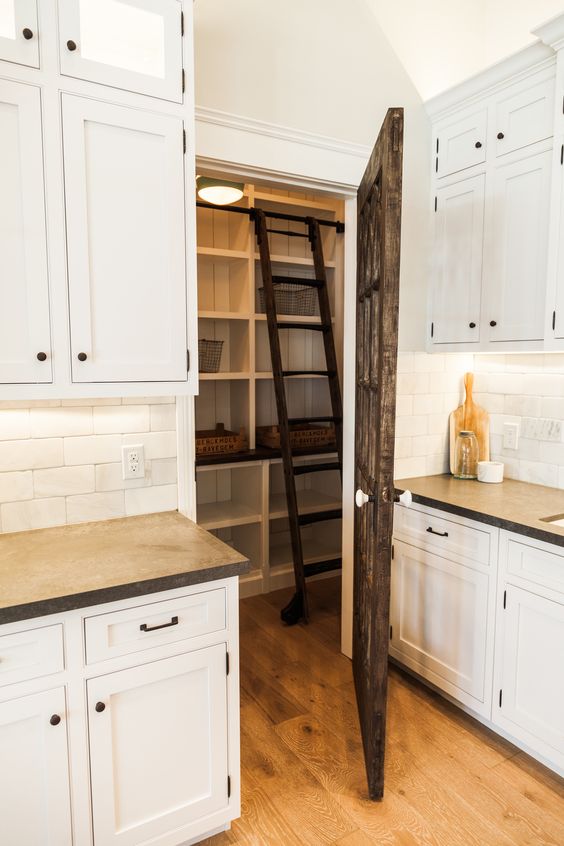 Custom pantry with rolling library ladder - by Rafterhouse.