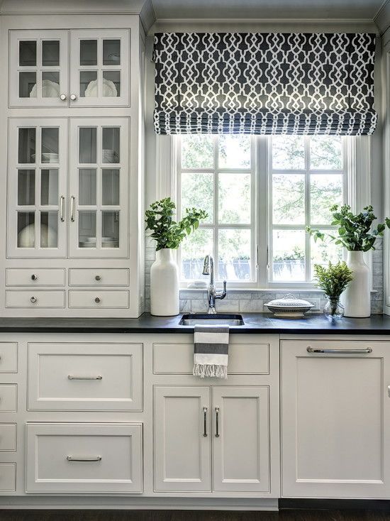 Dark floors and countertops, and white cabinets. Light but still has that good dark color in it to ground it well: