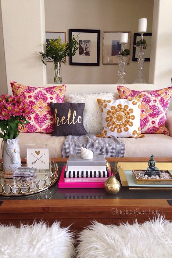 Decorating with bright colors is fun! The trick is how to do it right. When playing with color we 2 Ladies keep it simple. In this vignette simple means sticking to pink and gold as our bright colors. The neutral white fluffy pillow and grey throw from HomeGoods neutralize the brightness on the sofa. Gold accents on the coffee table and lamp (also from HomeGoods) continue to simplify the space so your eyes aren't overwhelmed by all the pattern play and color. Sponsored by HomeGoods