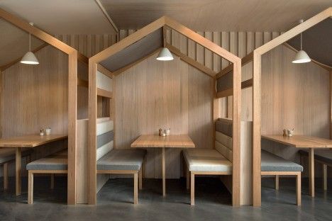 Dining areas within this Melbourne restaurant are housed beneath individual pitched roofs, which local practice Biasol Design Studio added to give the space a 