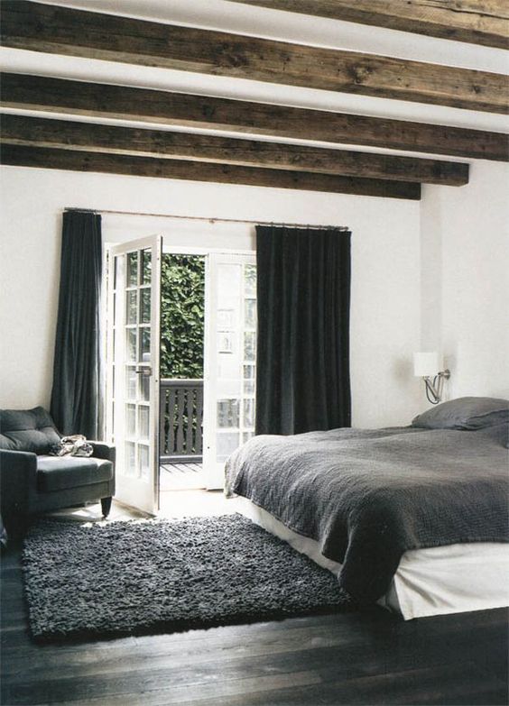 exposed beams and dark textiles