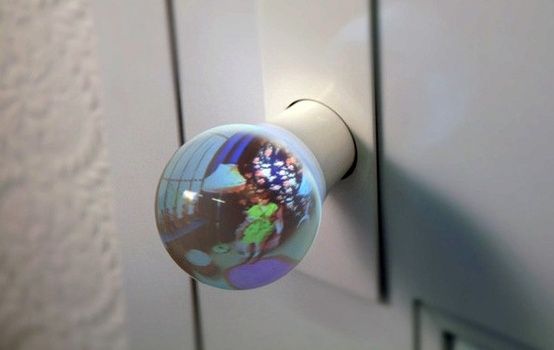Fisheyed Glass Globe Doorknobs - the globe on your end of the door provides a wide-angle view of what's on the other side, which is achieved by collecting and reflecting light soaked up by another globe on the other end.