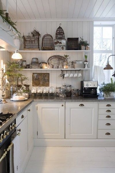 FRENCH COUNTRY COTTAGE: Vintage Kitchen . Love the bird  add a old world charm.
