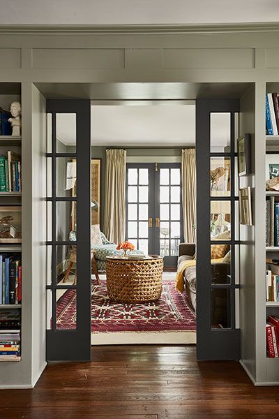 French pocket doors lead from the library to a cozy sitting room.