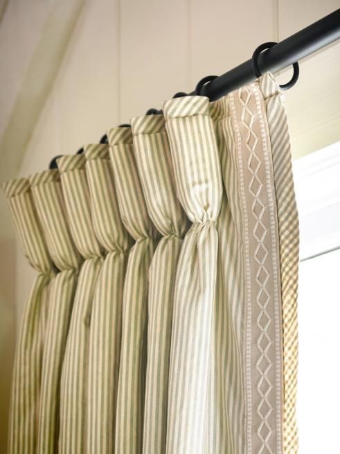 Goblet Pleated drapes embellished with a banded trim down the lead edge and the stripe cut on the bias at the top of the pleat and outside the banding. It's all in the details.