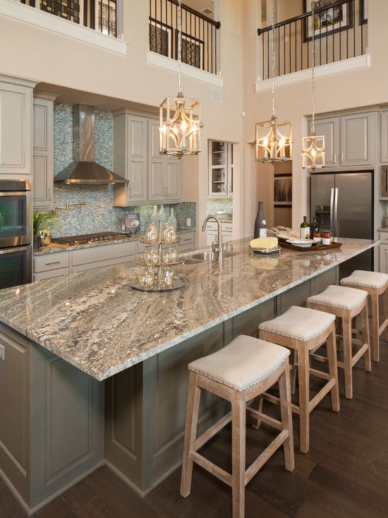 Gorgeous two story kitchen, granite countertops, pendant lighting, blue mosaic backsplash tile, grey cabinetry, extra large island | Five Star Interiors