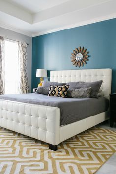 I love the different colours use, especially the grey with the turquoise and yellow accent -- Blue master bedroom