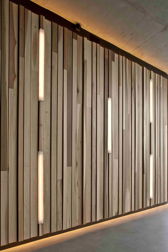I love the wooden wall feature with inset light strips and top/bottom lighting.