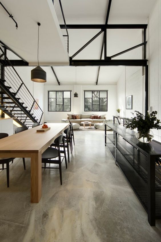 Industrial aesthetic steel trusses and polished concrete floor. Love