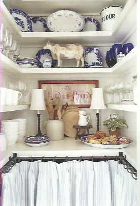 Kitchen pantry with blue & white dishes & skirted with ticking stripe - Mary McCollister Finch