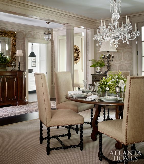 Lanham painted the dining room ceiling blue and upholstered walls in a Jasper fabric.