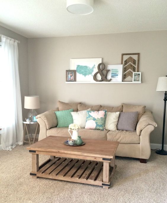 Living Room Makeover with weathered wood, green, blue, white accents, and ledge gallery wall