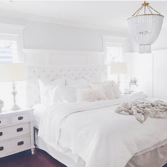 Love the chandelier, nightstands & white.
