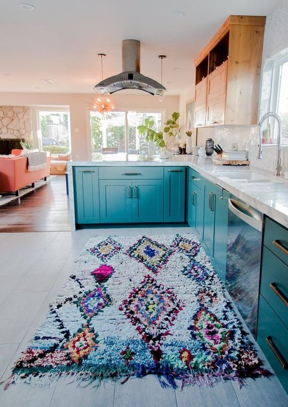 Love the color of the cabinets and the coral furnishings.