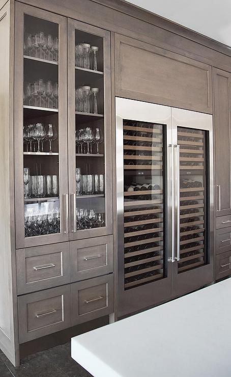 Love the gray washed cabinets, and glassware storage. Side By Side Wine Coolers. Stunning kitchen design from H Ryan Studio