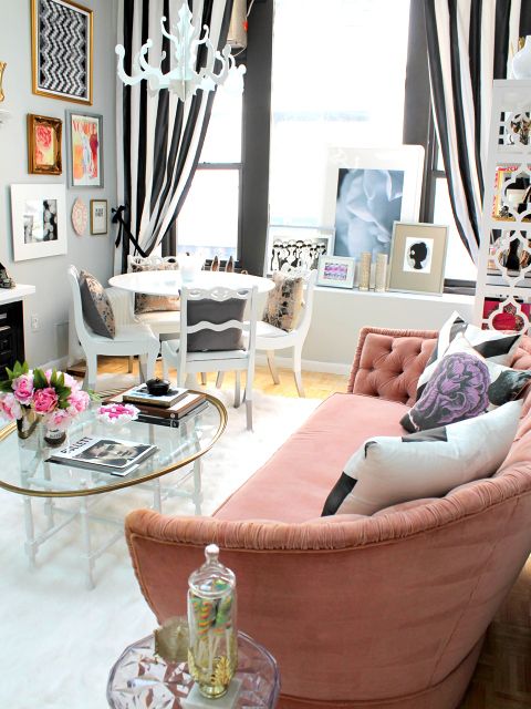 Nichole Loiacono Design | NYC Fashion PR Office. Striped drapes, tufted sofa and bold black and white pillows