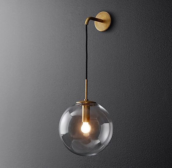 RH Modern's Languedoc Sconce:The character of 1960s French lighting is captured in this sconce from renowned designer Jonathan Browning. With glass globes suspended from a slender brass frame, the fixture has the appearance of magically floating in space.
