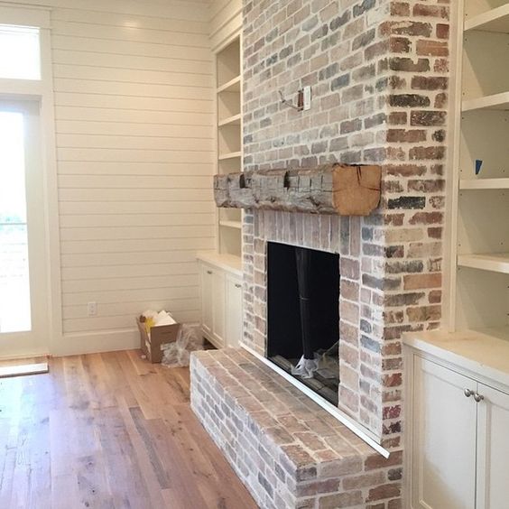 Rustic brick and wood beam fireplace is another good option