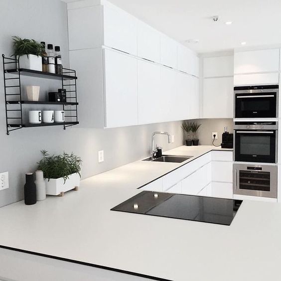 Scandinavian Interior Inspo on Instagram: “Loving the contrast of the black pocket string shelf in the all white kitchen of @frujosefsen and the living green elements keep the space looking fresh and alive ”