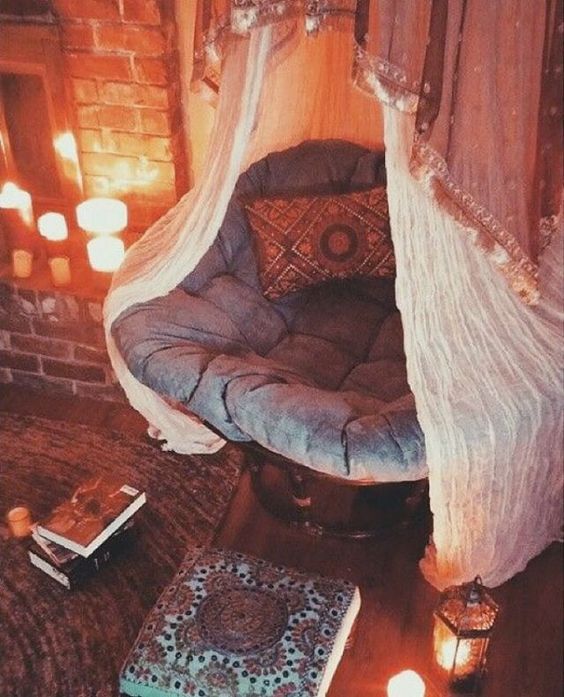 Set the mood for reading with faux candles near a big comfy chair.